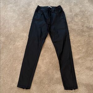 Black Slim Fit Pants . Faux leather slim pants with a sheen.